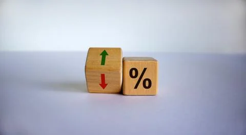 Wooden cubes changes the direction of an arrow symbolizing that the interest  Stock Photos