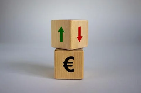 Wooden cubes changes the direction of an arrow symbolizing that the euro are  Stock Photos