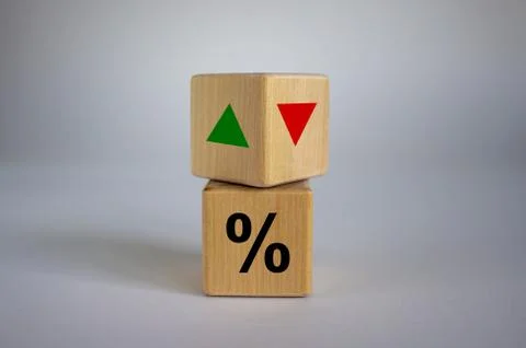 Wooden cubes changes the direction of an arrow symbolizing that the interest  Stock Photos
