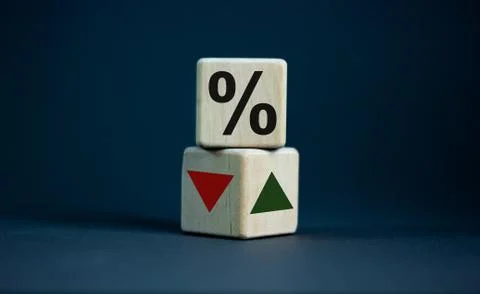 Wooden cubes changes the direction of an arrow symbolizing that the interest  Stock Photos