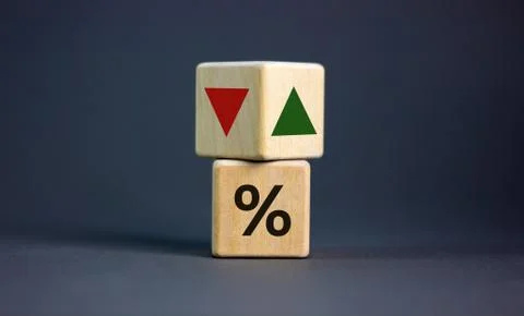 Wooden cubes changes the direction of an arrow symbolizing that the interest  Stock Photos