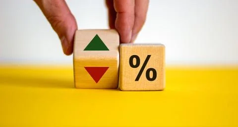 Wooden cubes changes the direction of an arrow symbolizing that the interest  Stock Photos