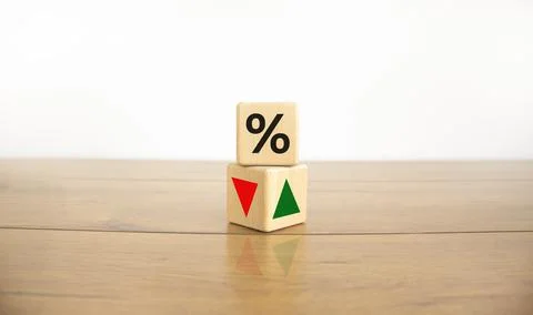 Wooden cubes changes the direction of an arrow symbolizing that the interest  Stock Photos