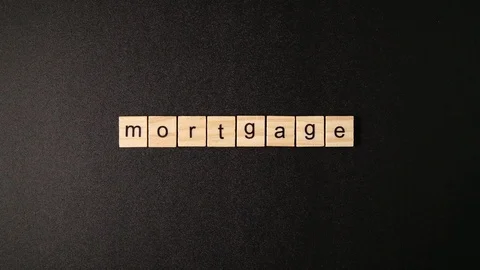 Wooden cubes open and sets up a word "Mortgage" Stockbeeldmateriaal 88264184