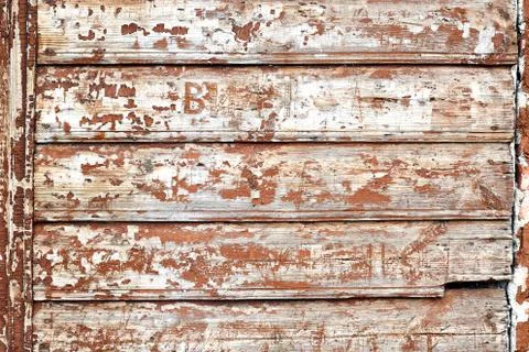 Wooden damaged texture background with tree bark pieces and leterring on it Stock Photos