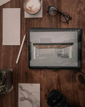 Wooden desk with multiple objects on it Stock Photos