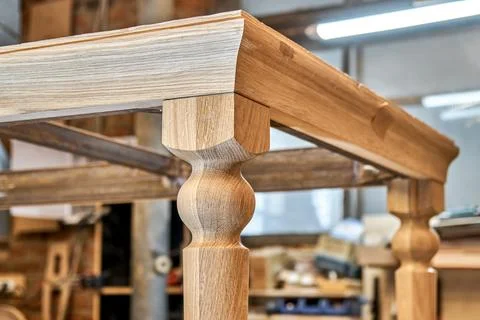 Wooden dining table of solid oak build process in workshop Stock Photos