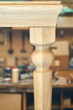 Wooden dining table of solid oak build process in workshop 写真素材