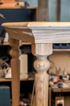 Wooden dining table of solid oak build process in workshop Stock Photos