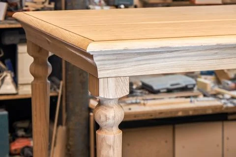 Wooden dining table of solid oak build process in workshop Stock Photos