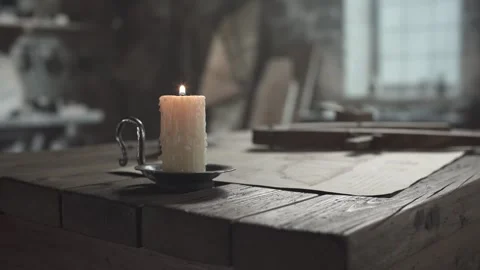 Wooden drafting compass tool on a desk inside a medieval workshop Video stock 337649543
