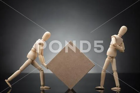 Wooden Dummy Lifting Cardboard Box Suffering From Back Pain Stock Photos