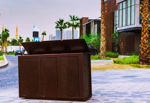 Wooden dustbin with three sections in front of a hotel outdoors Stock Photos