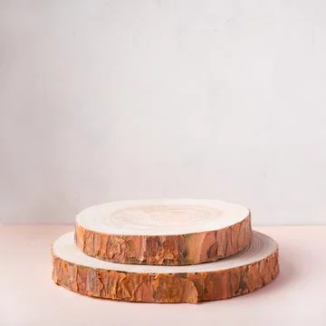 Wooden eco rustic pine tree wood circle disc platform podium on beige backgro Фото