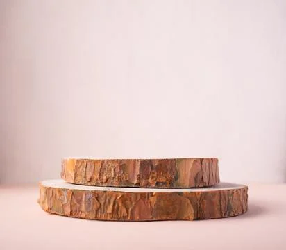 Wooden eco rustic pine tree wood circle disc platform podium on beige backgro Фото