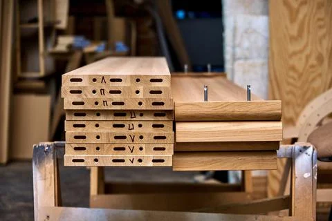 Wooden elements for double bed closeup. Furniture manufacture Stock Photos