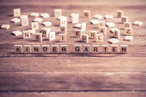 Wooden elements with letter collected to word kinder garten Stock Photos
