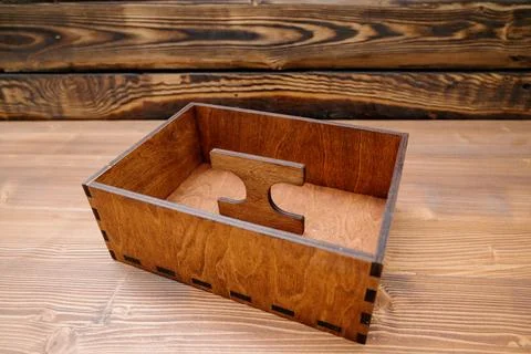 Wooden empty box on wooden background. Top view. Stock Photos