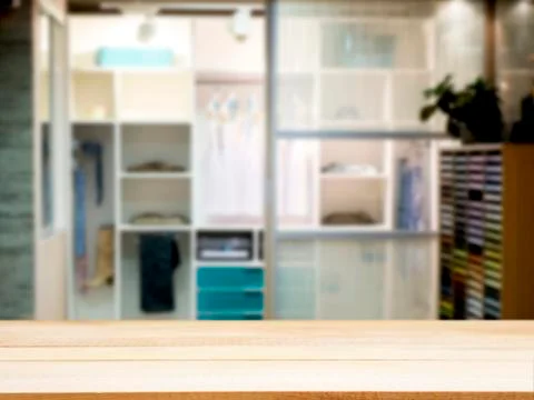 Wooden empty table in front of blurred closet room 스톡 사진