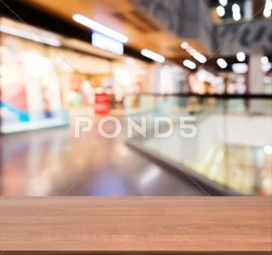 Wooden Empty Table In Front Of Blurred Mall - Stock Image - Everypixel