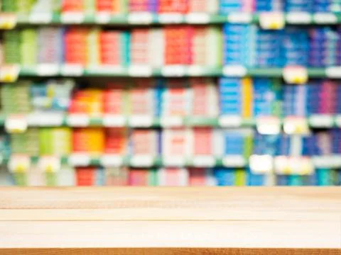 Wooden empty table in front of blurred supermarket Stock Photos