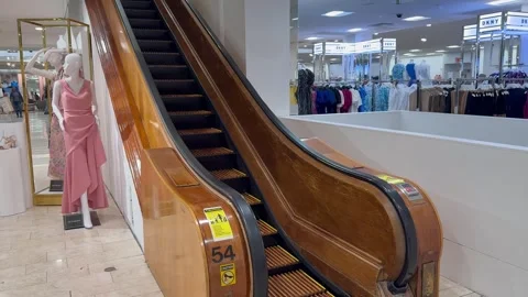 Wooden escalator inside the Macy's Herald Square department store, mall Stock Footage 340619986
