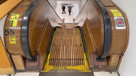 Wooden escalator inside the Macy's Herald Square department store, mall Stock Footage 340620019