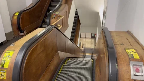 Wooden escalator inside the Macy's Herald Square department store, mall Stock Footage 340620027