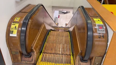 Wooden escalator inside the Macy's Herald Square department store, mall Stockbeeldmateriaal 340620225