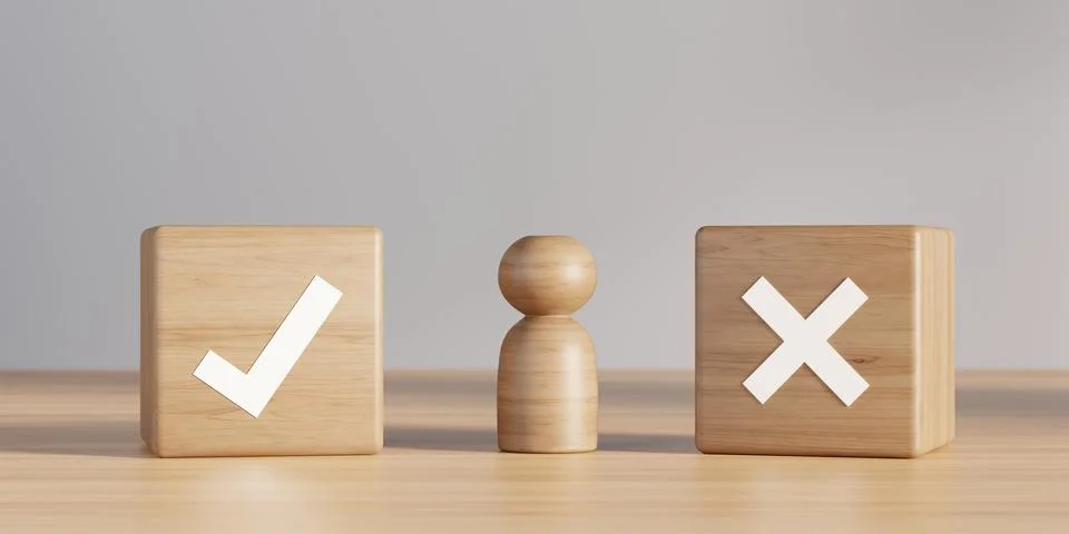 Wooden figure between boxes with checkmark and cross on table over grey wal.. Stock Illustration