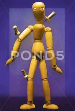 Wooden Figure With Pushpins In Joints