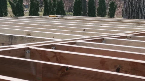 Wooden floor joints installed in parallel during construction of the deck or Stock Footage 332185532