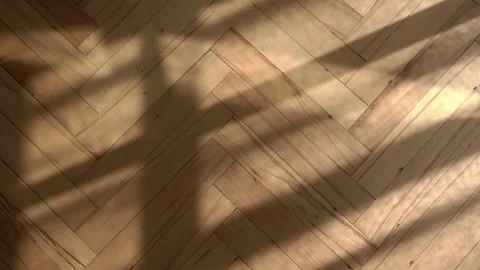 Wooden floor with shadows from the window background. Wooden parquet floor in Stock Footage 153830352