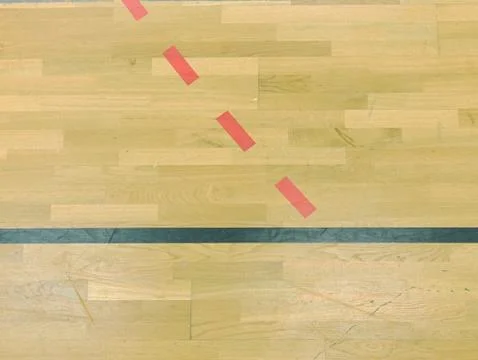 Wooden floor in sporting hall with solid and dotted lines.  Light reflection Stock Photos