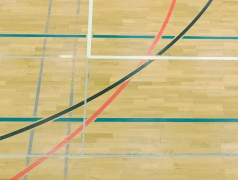 Wooden floor in sporting hall with solid and dotted lines.  Light reflection Stock Photos