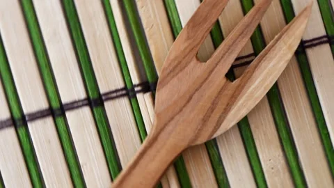 Wooden fork rotates on a board Video stock 247337241