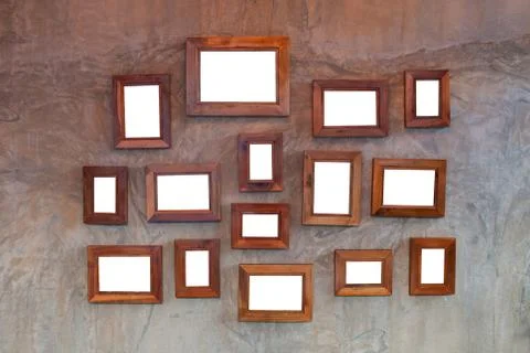 Wooden frame empty on the cement wall. Stock Photos