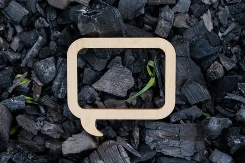 Wooden frame - a pointer inside which coal from a burnt fire Stock Photos