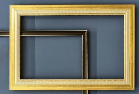 Wooden frames for pictures on a gray wall background. Stock Photos