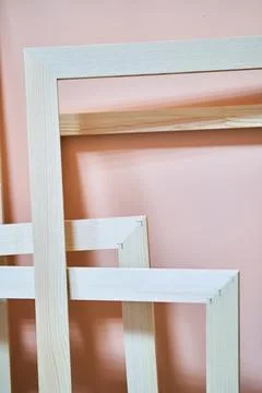 Wooden frames on a pink background. Frames for photos and paintings Stock Photos