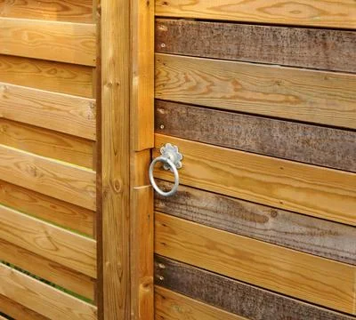 Wooden gate with ring lock for security and safety Stock Photos
