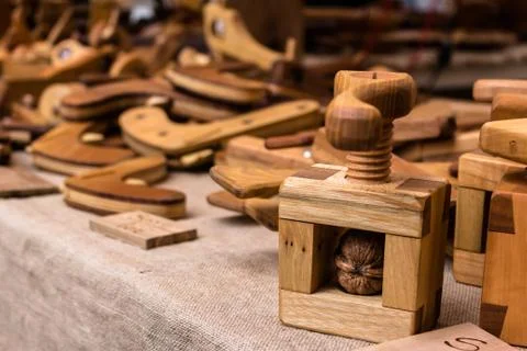 Wooden handmade nutcracker with walnut displayed on a banquet together other Stock Photos