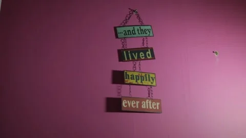 Wooden hanging wall decor reading and they lived happily ever after Stock Footage 341470182