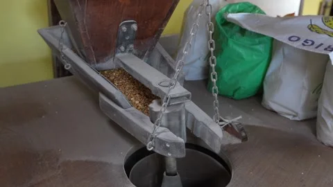 Wooden hopper feeding the corn to the mill Stock Footage 278528238