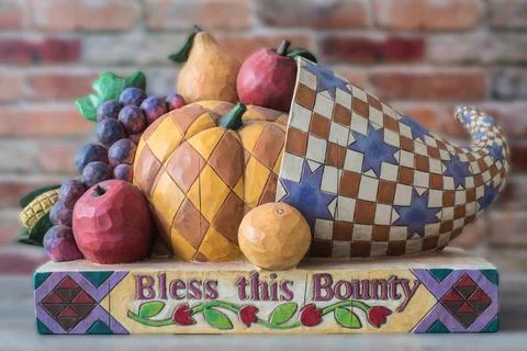 Wooden horn of plenty with patchwork fruit and Thanksgiving concept blessing Stock Photos