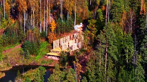 Wooden House Framing Under Construction in Golden Autumn Forest Stock Footage 342486283