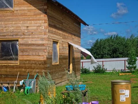 Wooden house for a rural plot in the spring Fotos de archivo