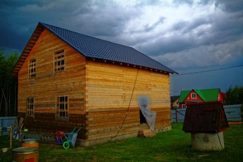 Wooden house for a rural plot in the spring Fotos de archivo