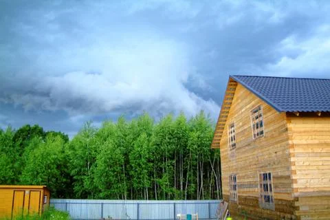 Wooden house for a rural plot in the spring Fotos de archivo