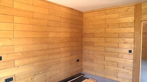 Wooden Interior Corner Wall with Horizontal Timber Planks in Minimalist Room Video stock 313934507